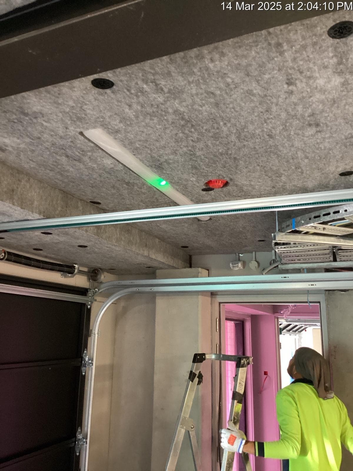 Soffit liner panels fixed to a concrete carpark ceiling